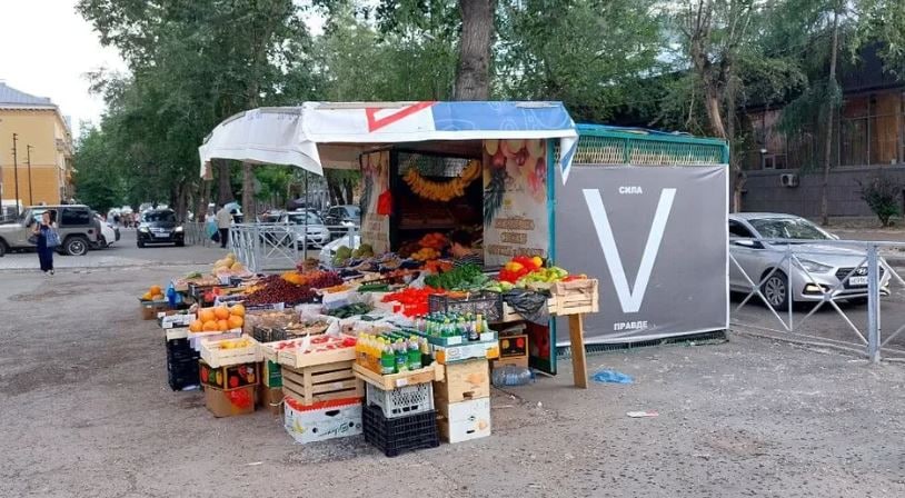V symbol on an illegally set vegetable tent