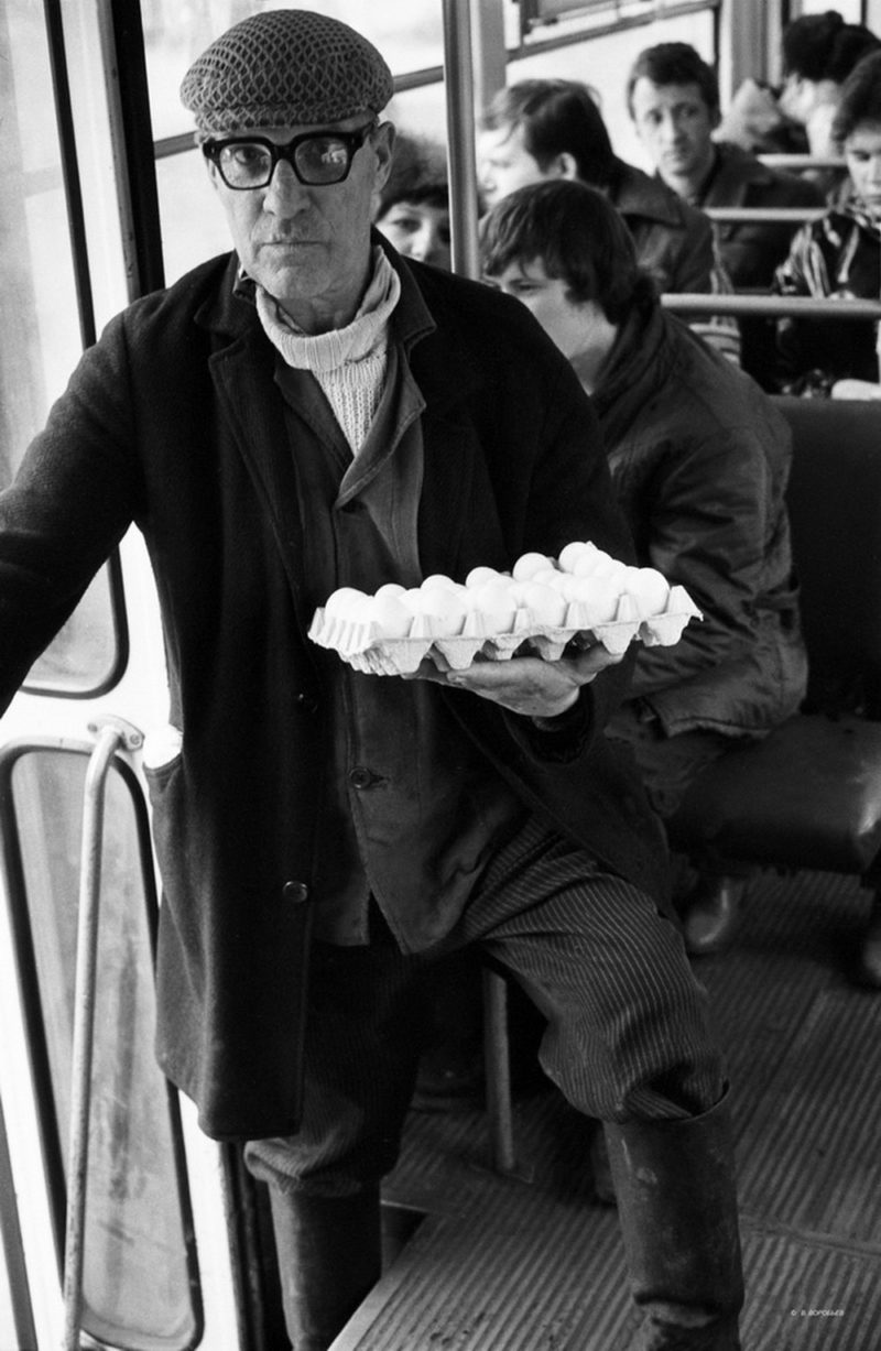 Man with chicken eggs on the bus